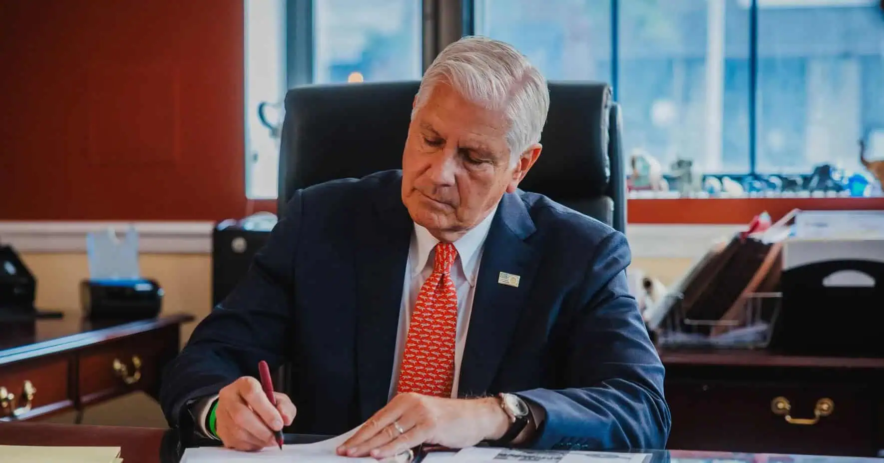 Bruce Blakeman working at his desk